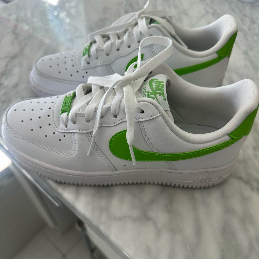 Hardly worn Nike Air Force 1s; white with lime green swoosh, good condition.